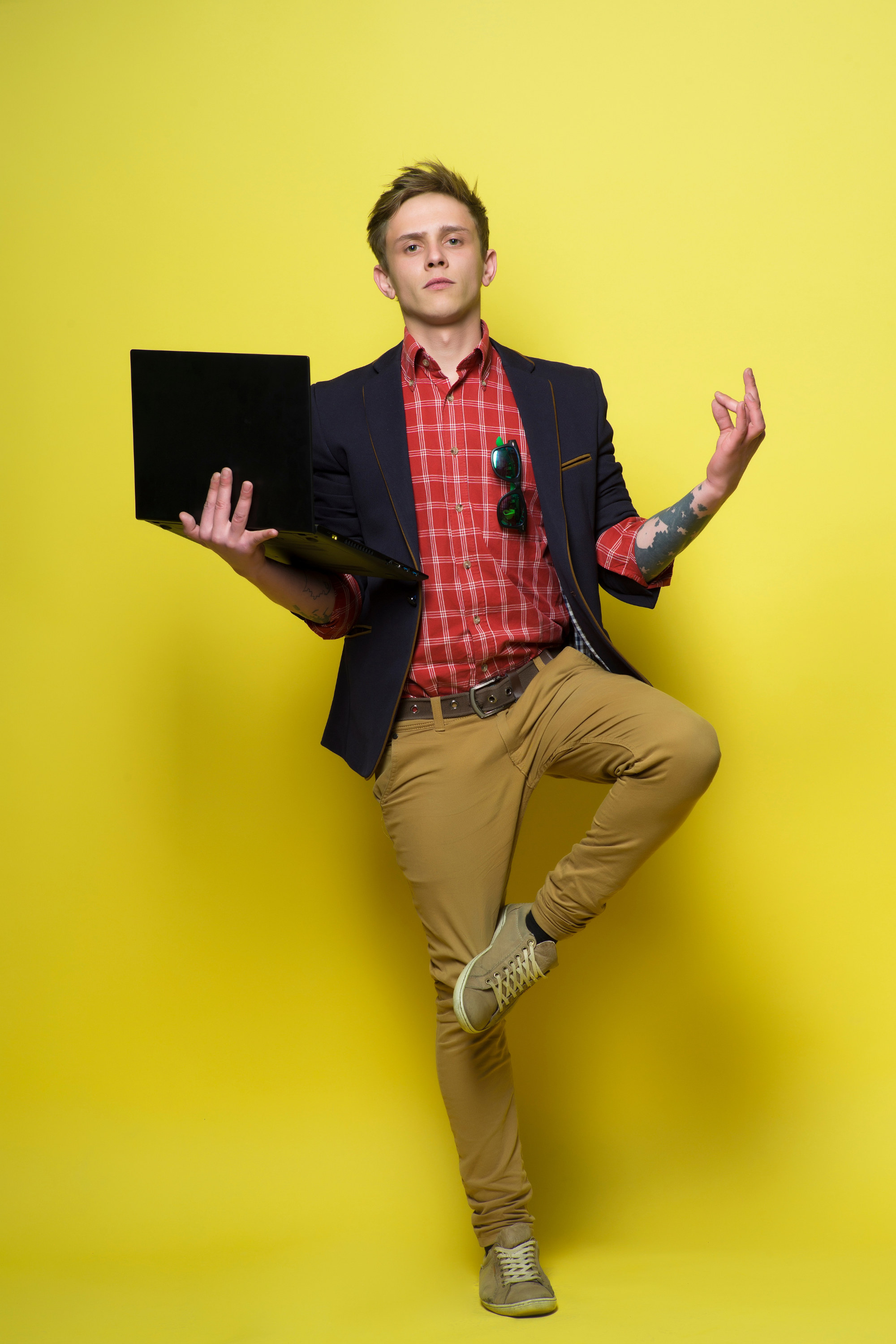 Nonprofit professional enjoying coaching support while doing professional development against yellow background